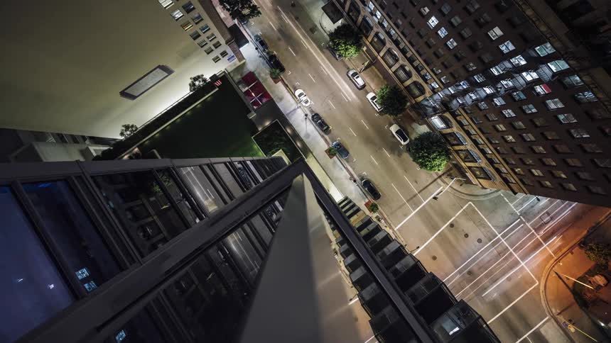 Traffic passing along an urban intersection at night