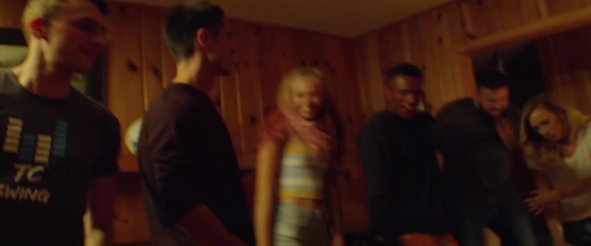 A group of people dance at a party