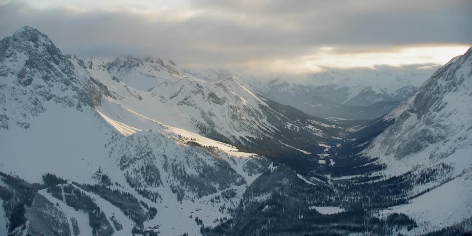 Snow covered mountains on cloudy day