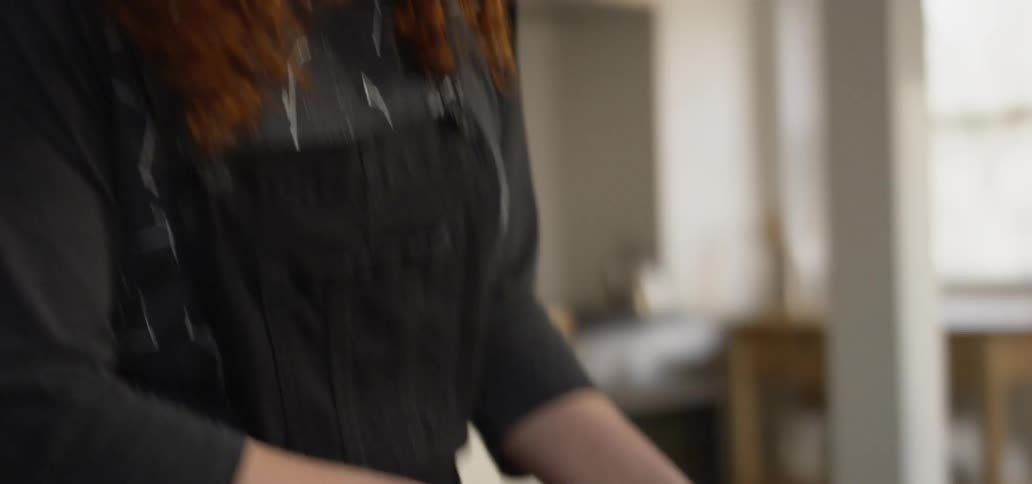 Woman and child cooking in a kitchen