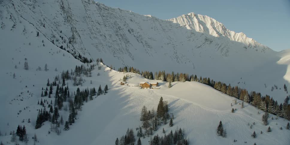 Sun shines down over snowy mountains
