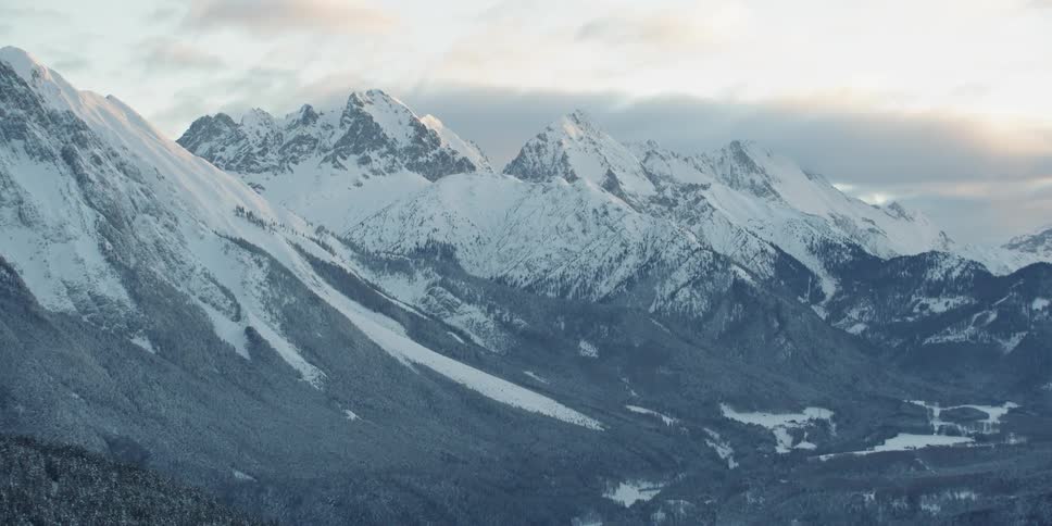 The mountain range is covered in snow