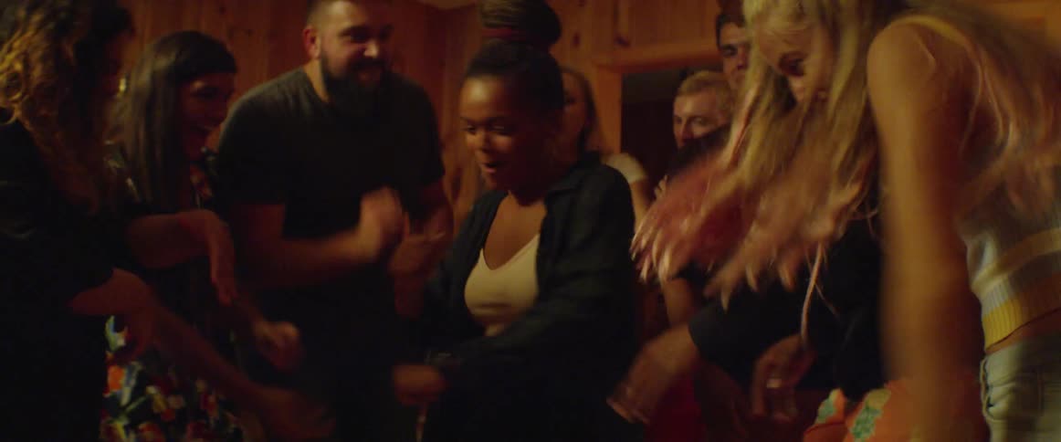 People party and dance together singing in the room