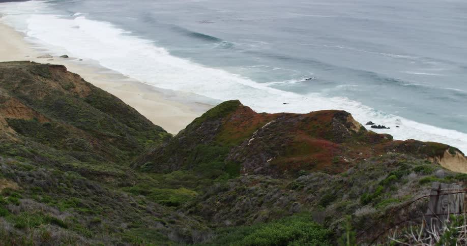 Ocean waves wash up onto a sandy beach