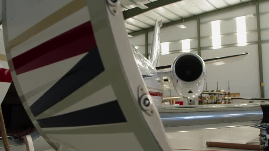 Airplane sits in a hangar
