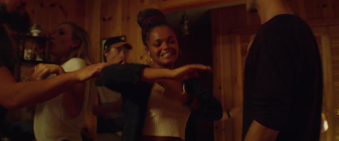 People dance at a house party