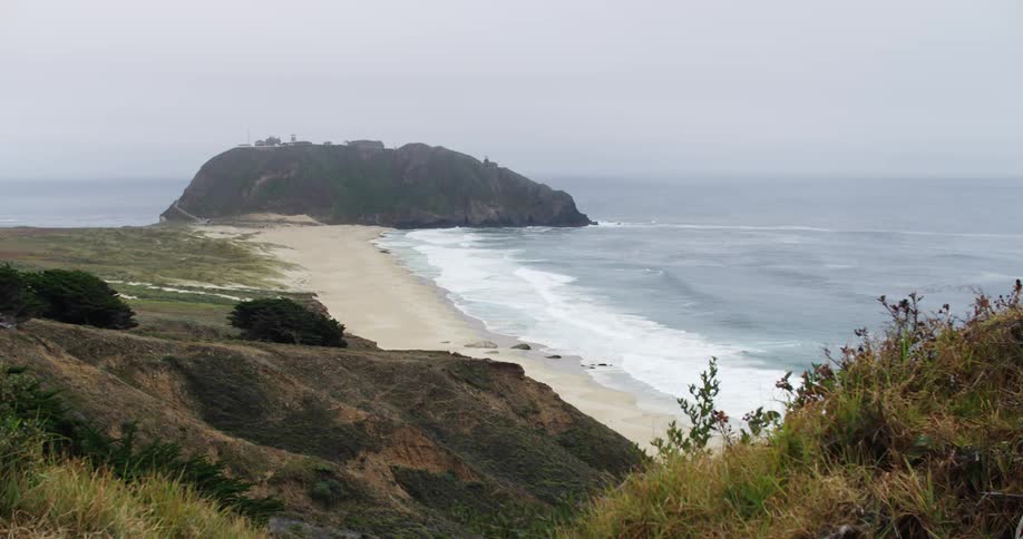 View of a beach and a rocky plateau in big sur