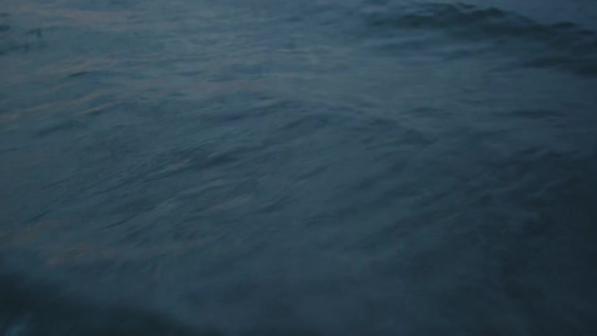 Waves splashing at sunset