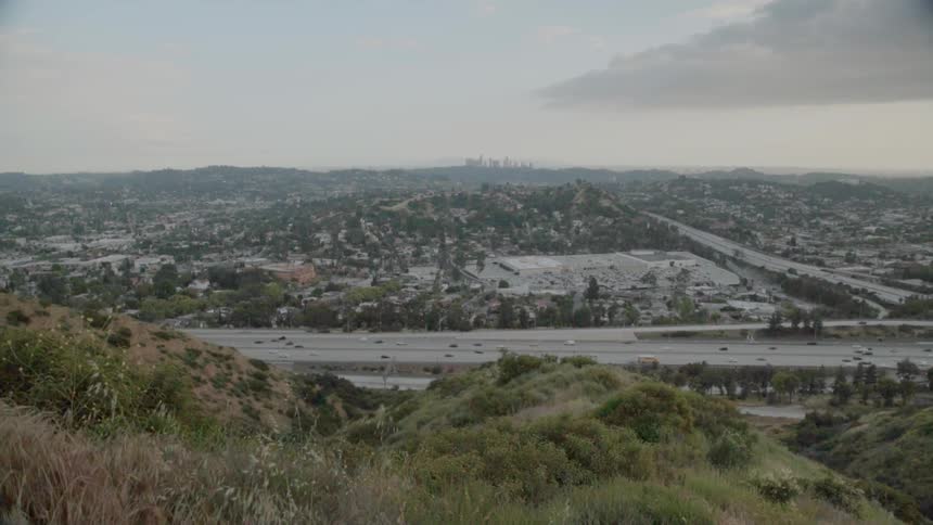The vehicles travel across the highway below