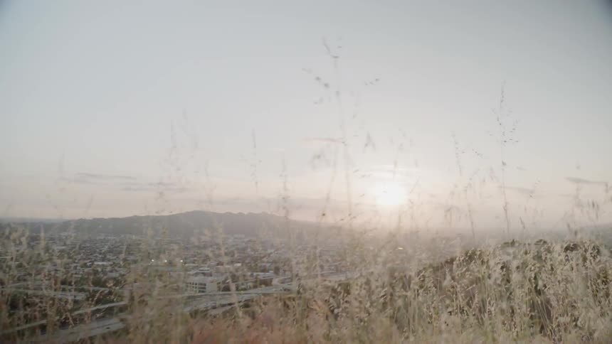 The sun sets over a city