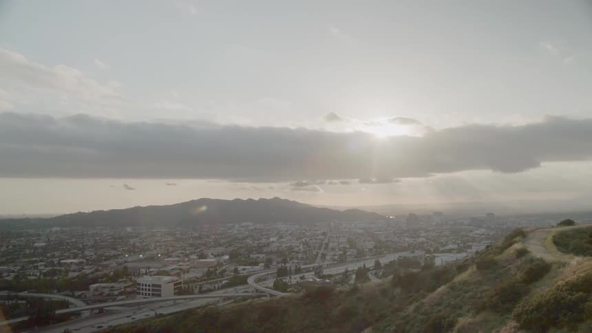 The sun sets over a city