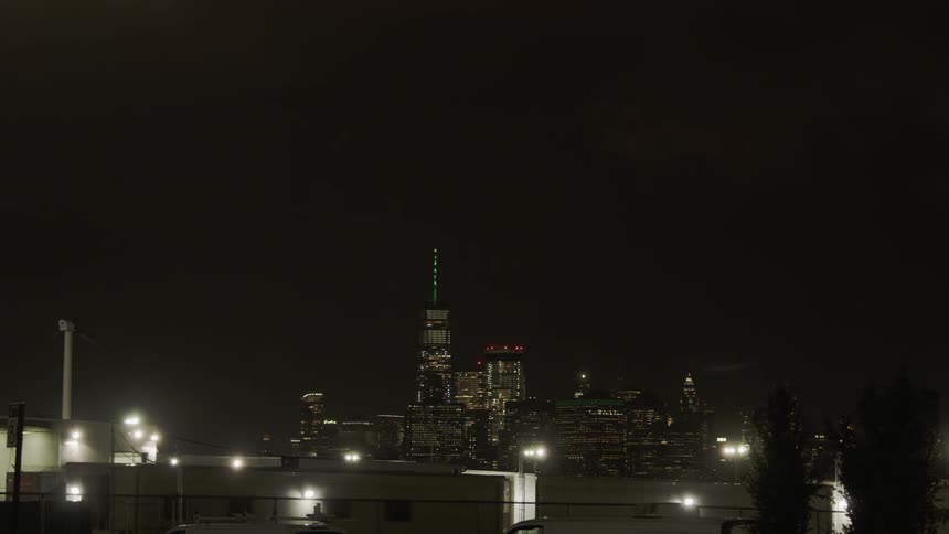 The lights flash on the buildings of the city