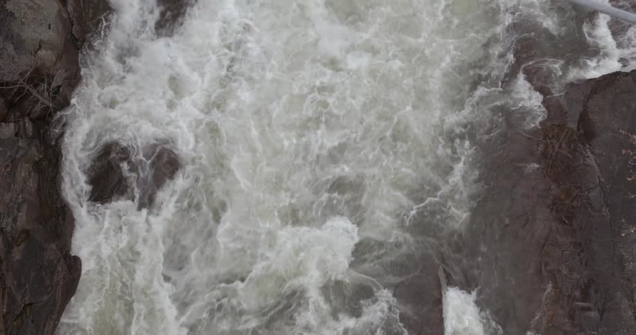 Water is flowing through a narrow gorge during the day