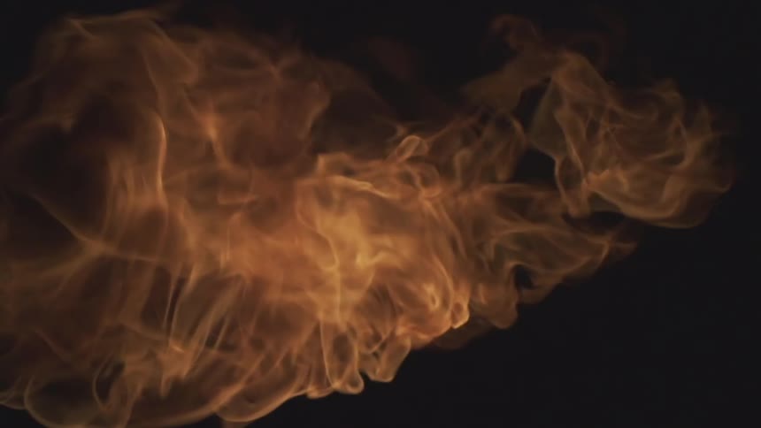 Large flame explodes in a dark area