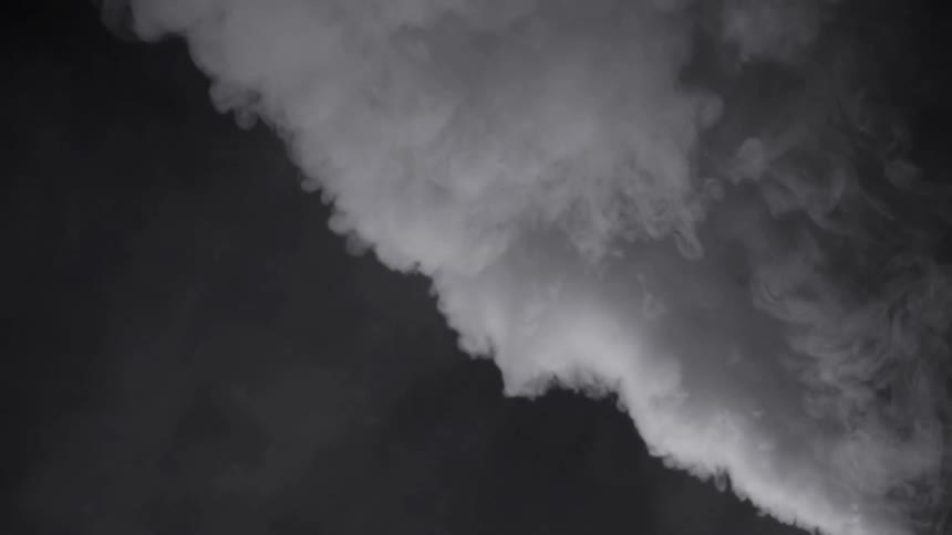 Smoke filling the air in a dark area