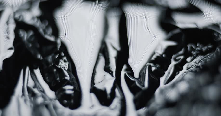 Light shines on a black shiny surface
