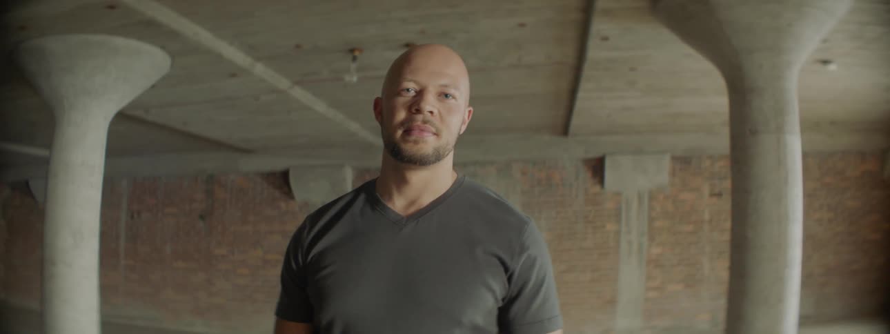 A man stands in an empty room