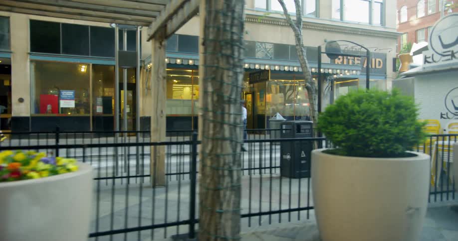 People walking on the sidewalk downtown
