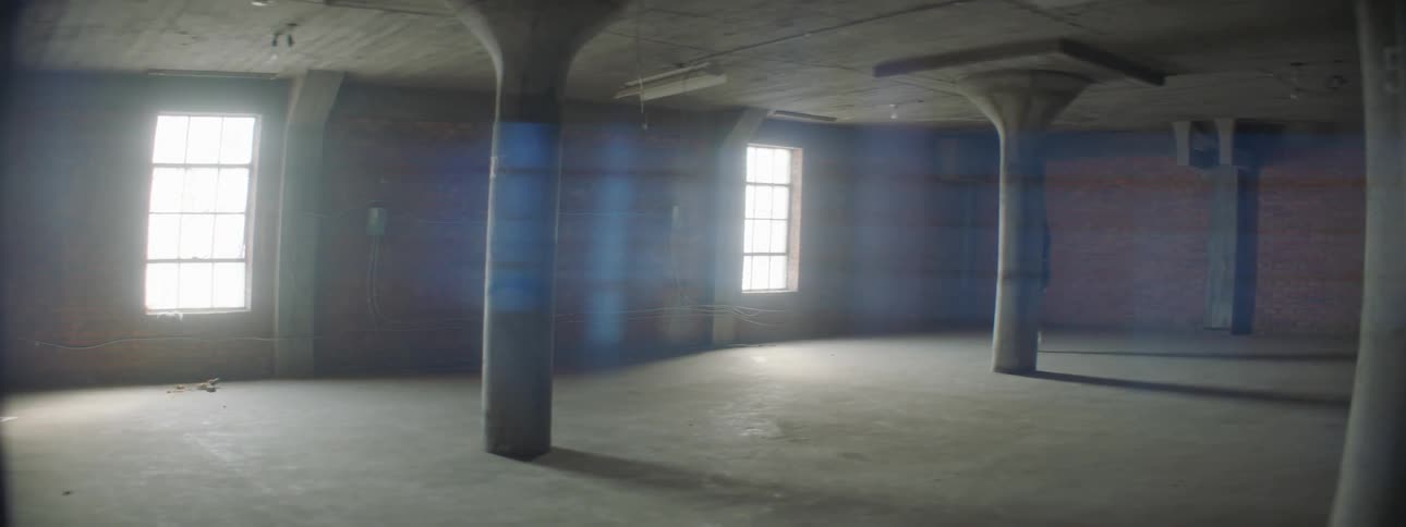Woman walks in an empty room