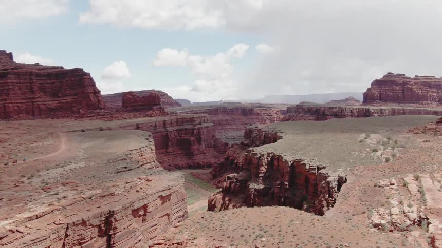 Clouds float above a canyon in the desert