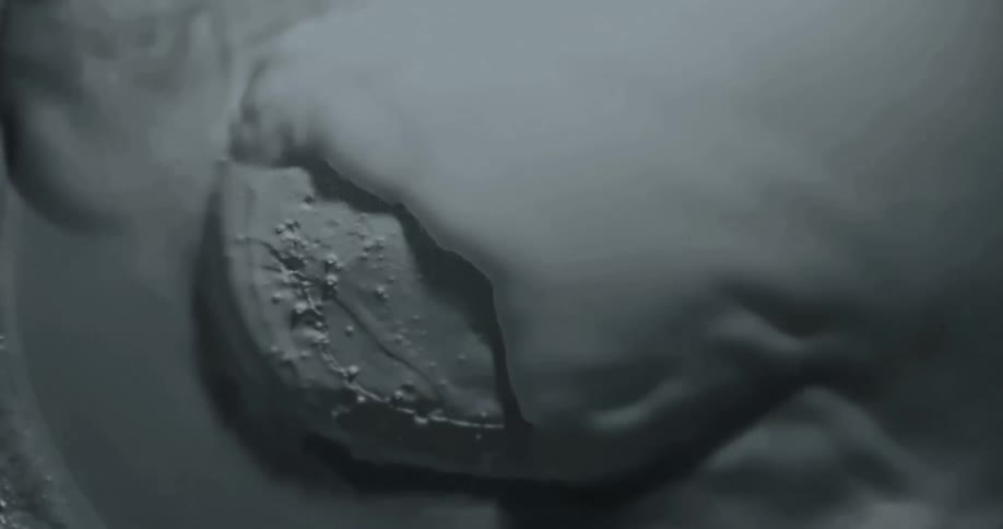 White liquid spreads over a round surface