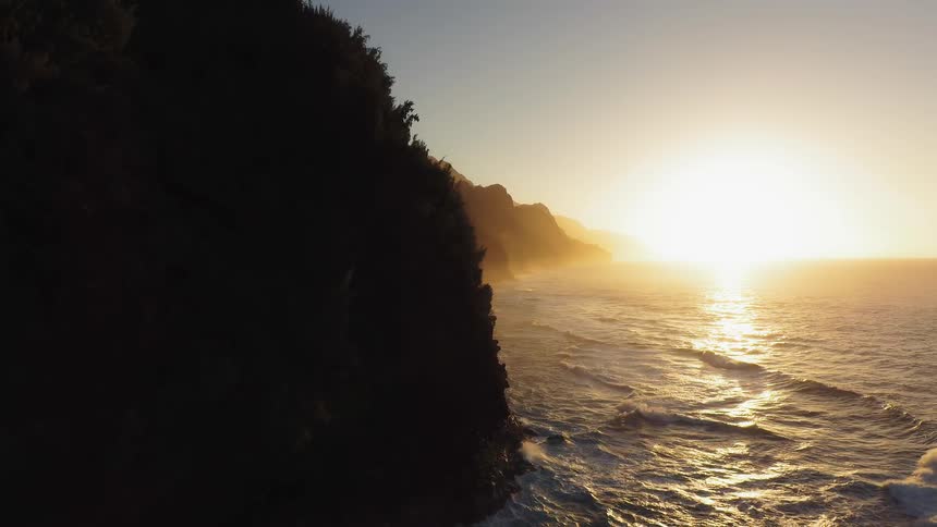 Rolling waves under a bright sunny sky