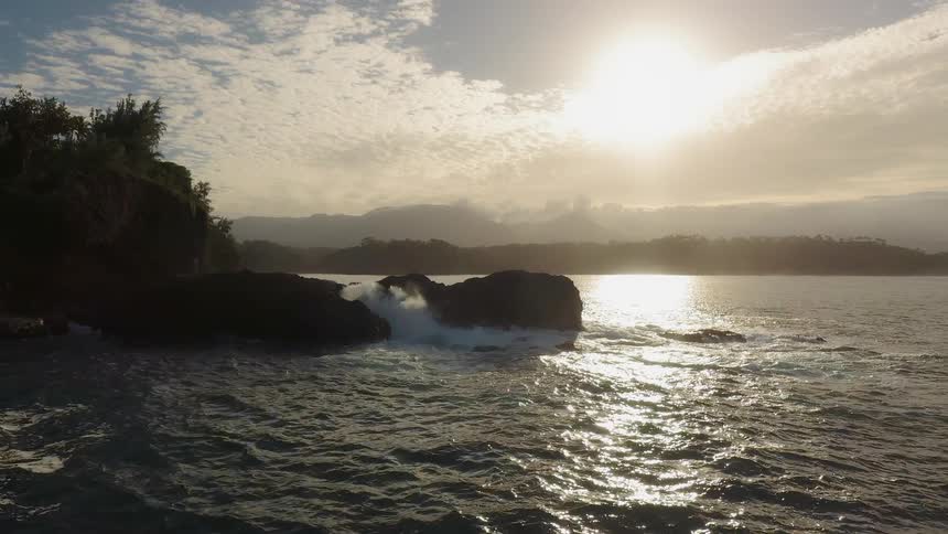 The sun sets over a beach