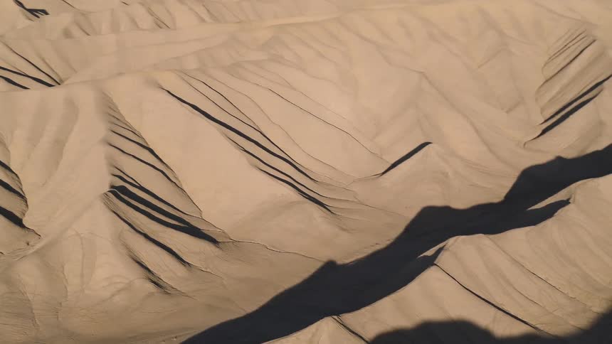 The desert is covered with many rows of dunes