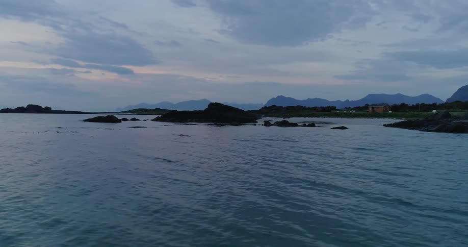 Flowing water splashes near small island