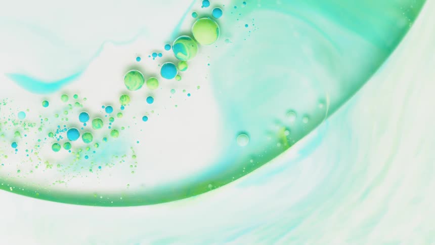Blue and green bubbles in liquid