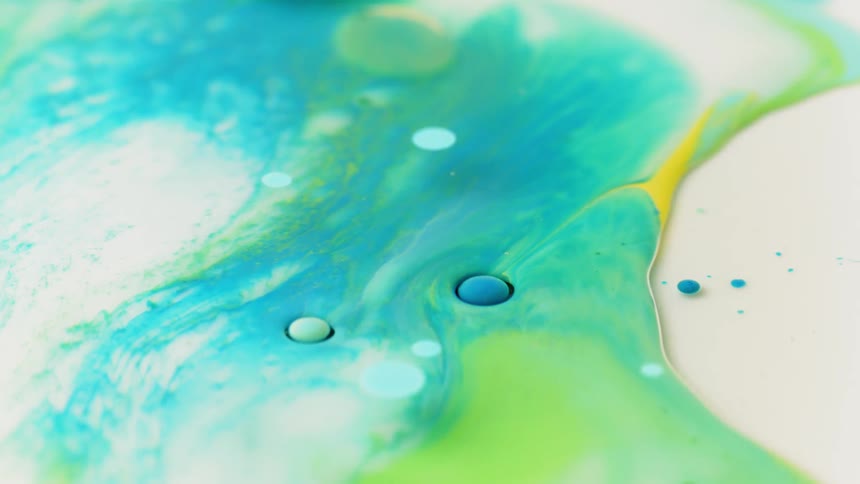 Colorful paint flows on a surface