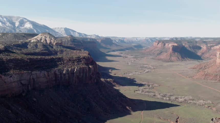 Cliffs and rock formations stand in the wilderness