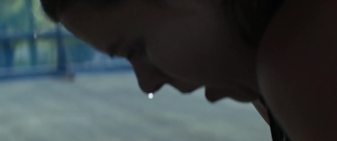 A woman is dripping with sweat