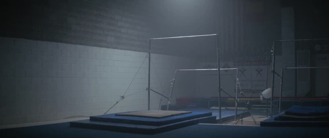 The gym is dark and empty
