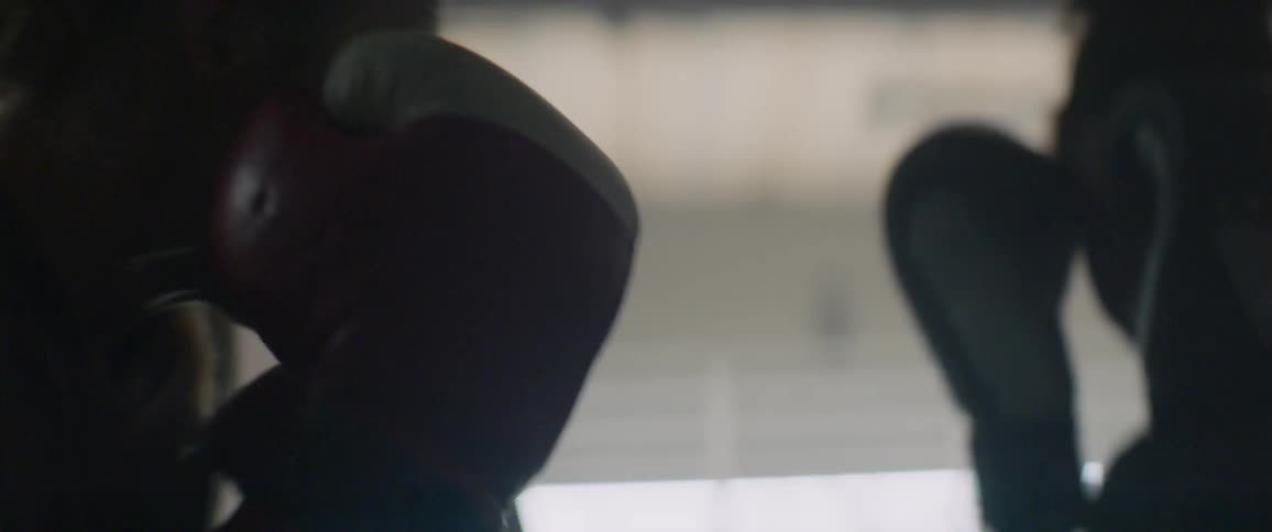 The two people spar in the ring
