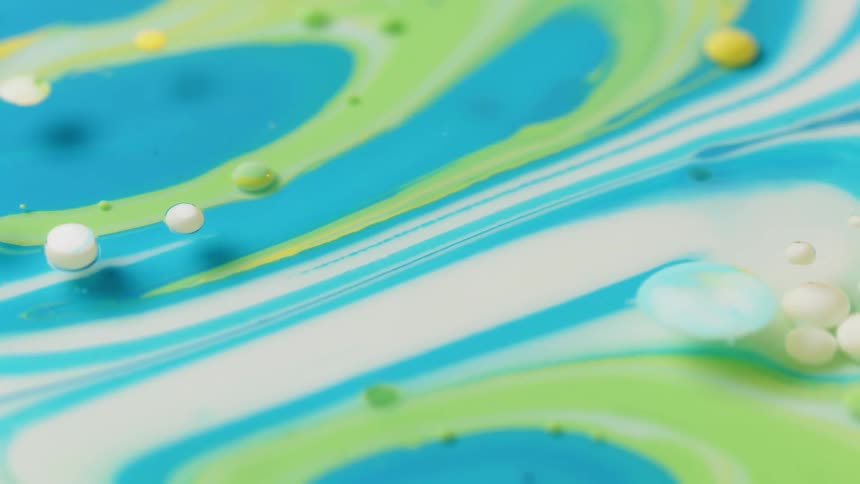 Colorful paint mixes and flows