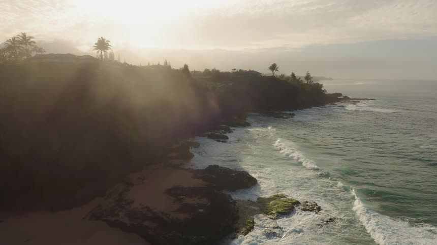 The sun sets over a beach