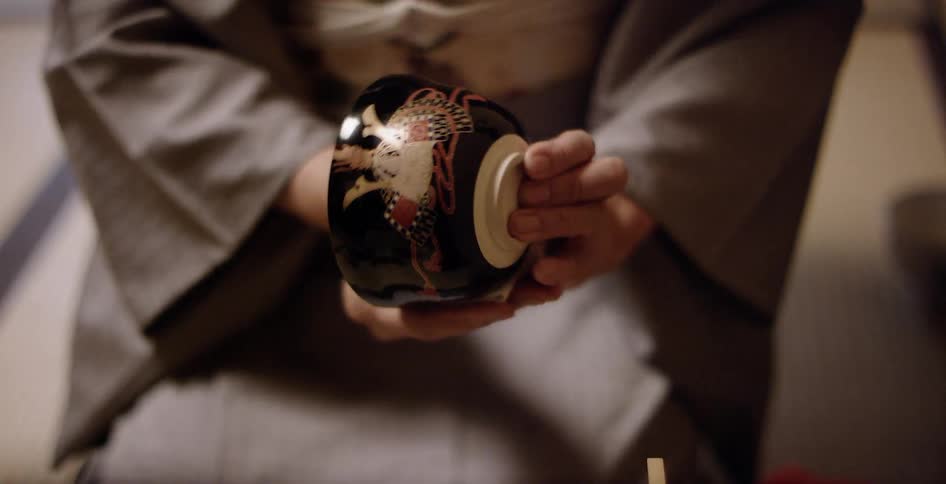 The person is cleaning a small bowl