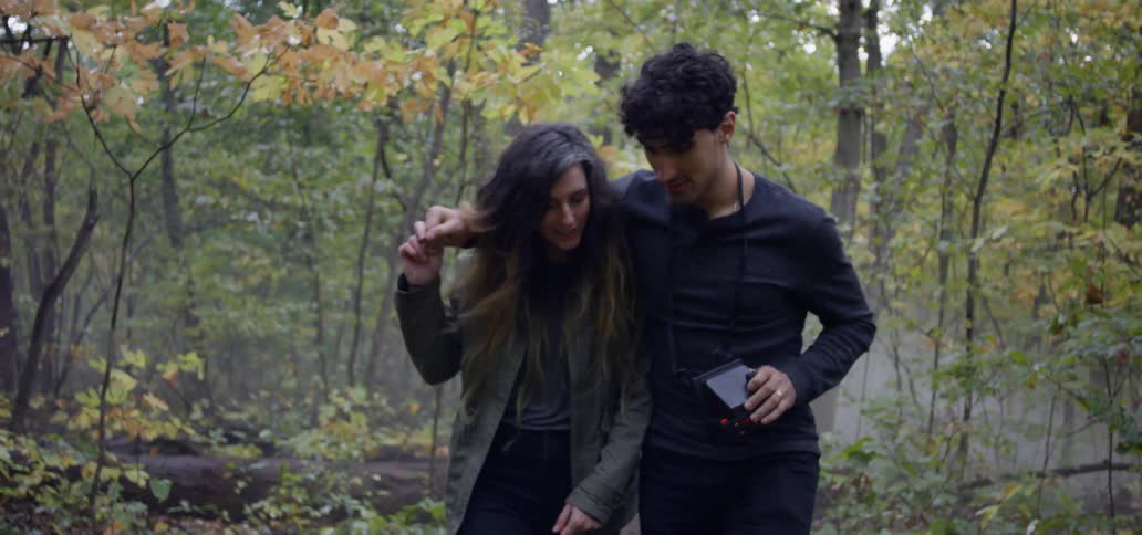 Man and woman hike in a forest
