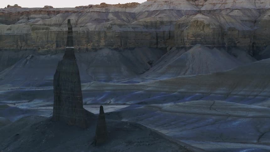 Rock formations stand in a desert