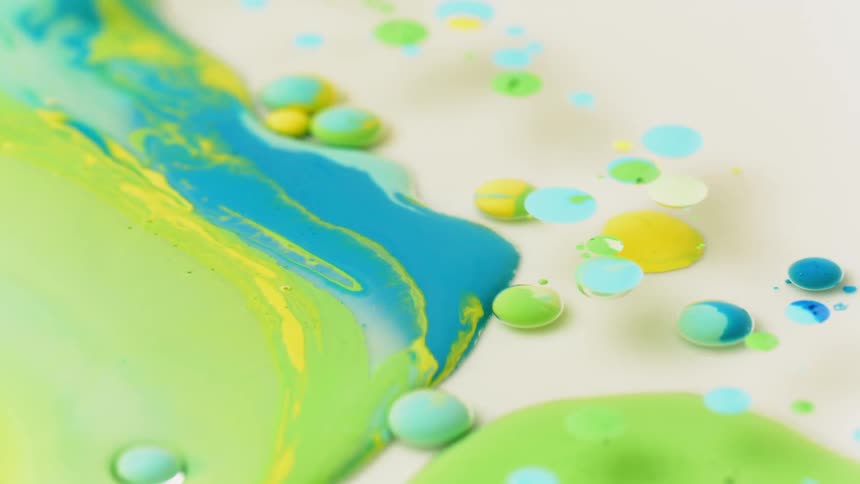 The water is full of green and blue ink