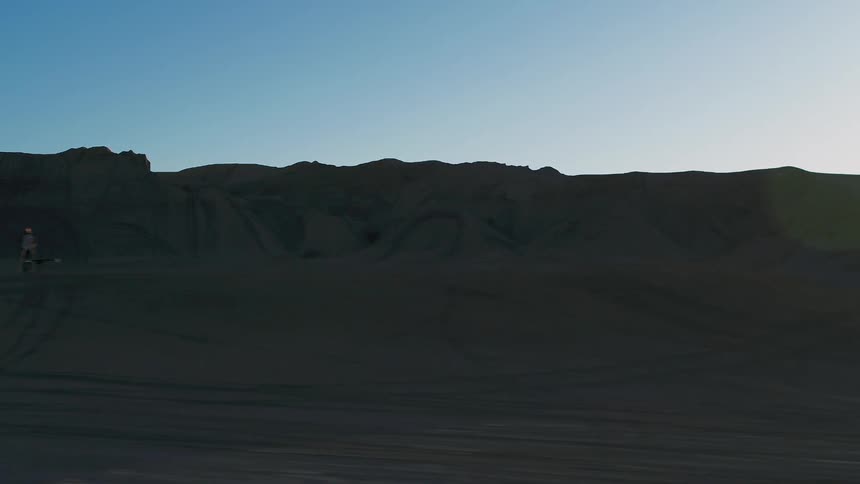 Sun rises over a sandy desert