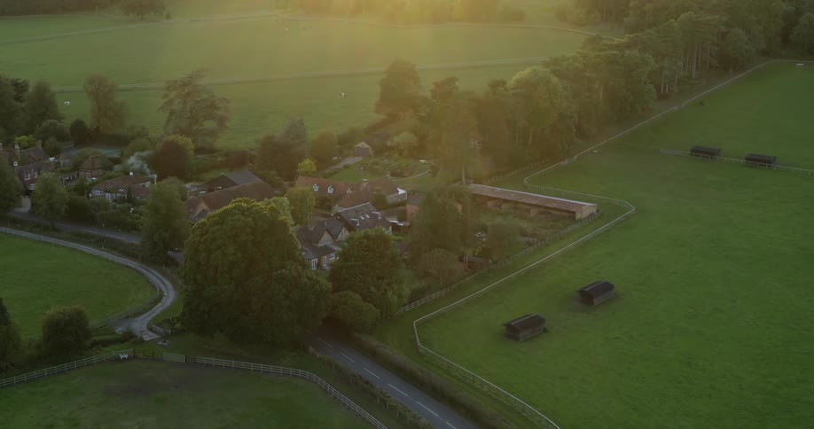 Sun shines down over fields and houses