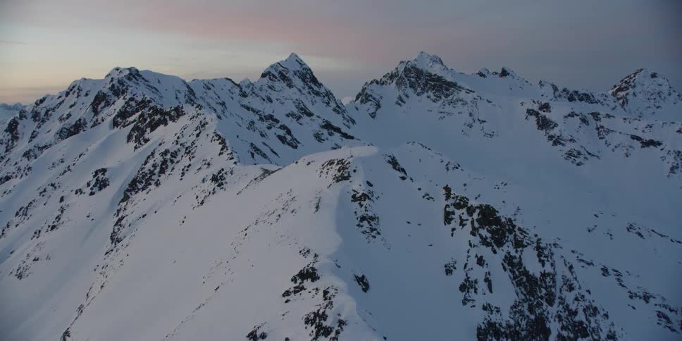 Snow covers the mountain landscape