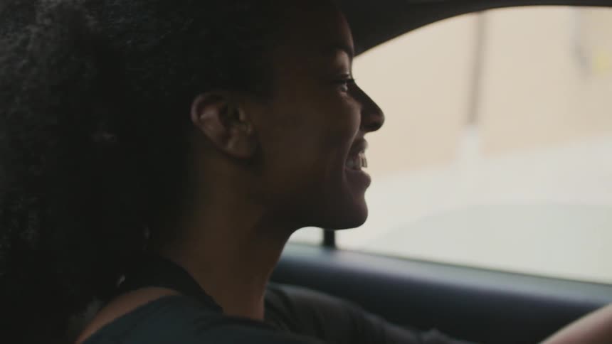 Woman in a vehicle smiling