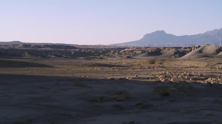 Dirt and rocks cover a desert landscape
