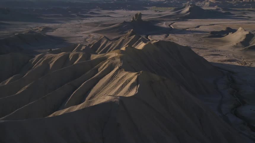 Shadows in a sandy hilly desert