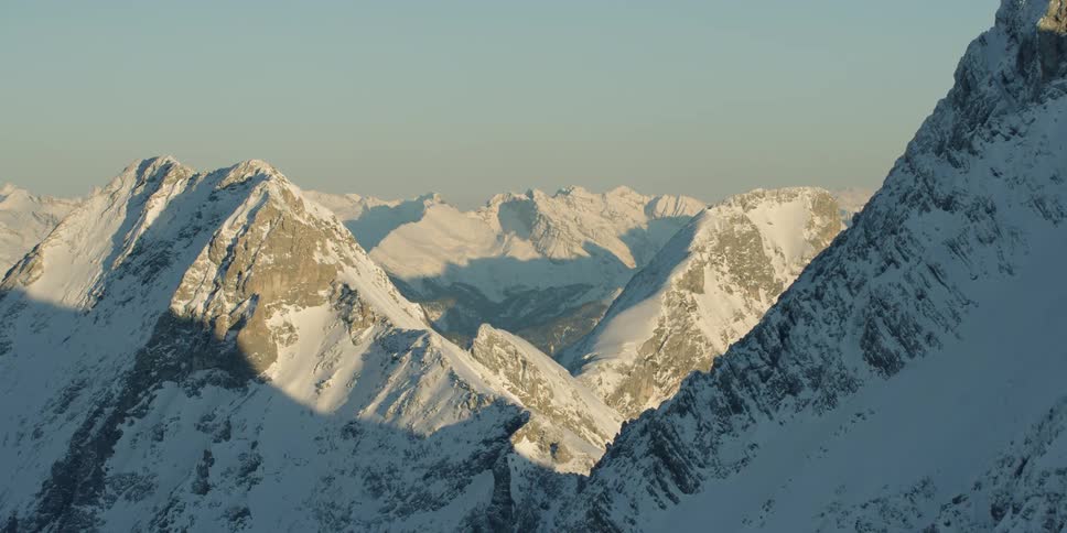 Snow covers tall mountain peaks