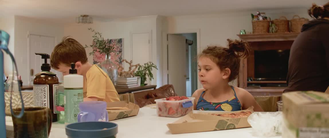 Children eat at a kitchen counter