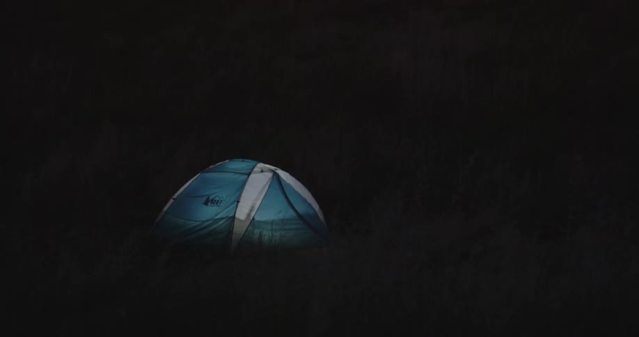 A tent glows in the dark